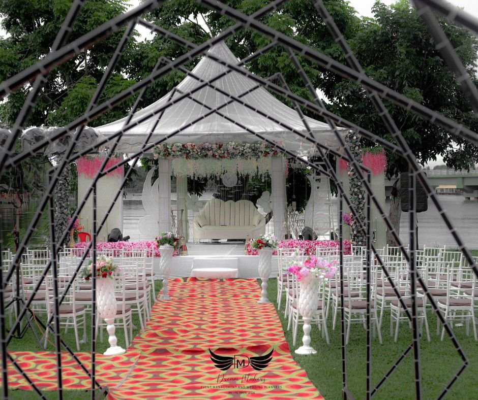 Luxurious stage decoration with floral drapes and LED lighting by an Event Management Company in Kollam