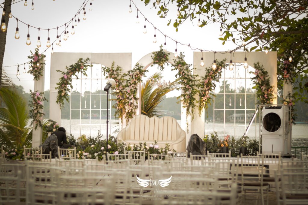 Elegant stage decoration by the Best Event Management Company in Kollam, featuring stunning floral arrangements, vibrant lighting, and luxurious drapery