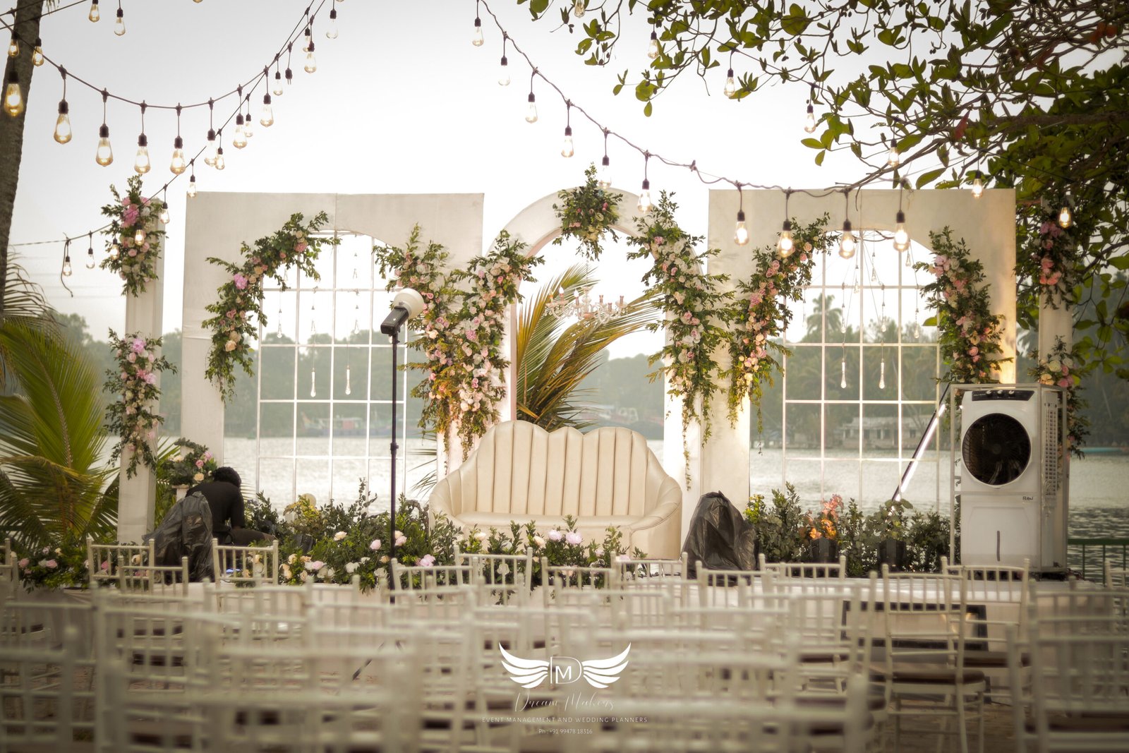 Elegant stage decoration by the Best Event Management Company in Kollam, featuring stunning floral arrangements, vibrant lighting, and luxurious drapery